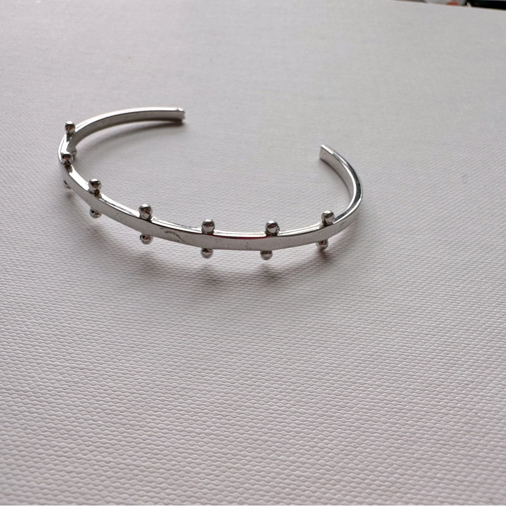 Modern silver cuff bangle.